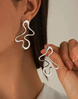 The Esla Minimalist Irregular Hollow Geometry Metal Stud Earrings