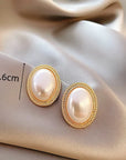The Lune Collection 
Delicate Baroque Pearl Oval Stud Earring
