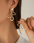 The Esla Minimalist Irregular Hollow Geometry Metal Stud Earrings
